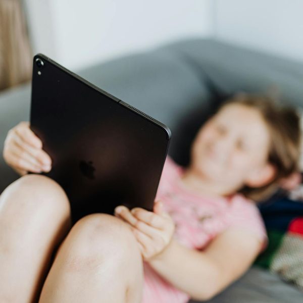 A person's hands gently resting on their knees.