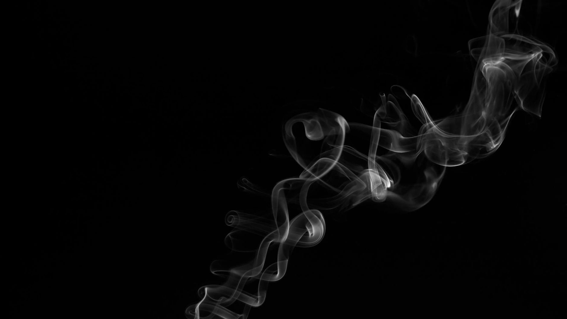 Abstract dark background with golden light trails suggesting fluid motion.